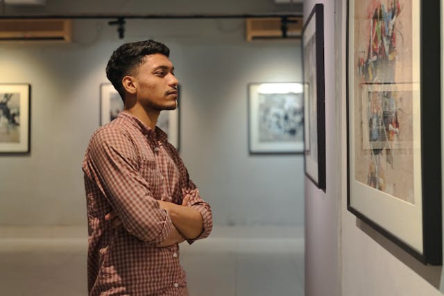 person looking at art in a gallery